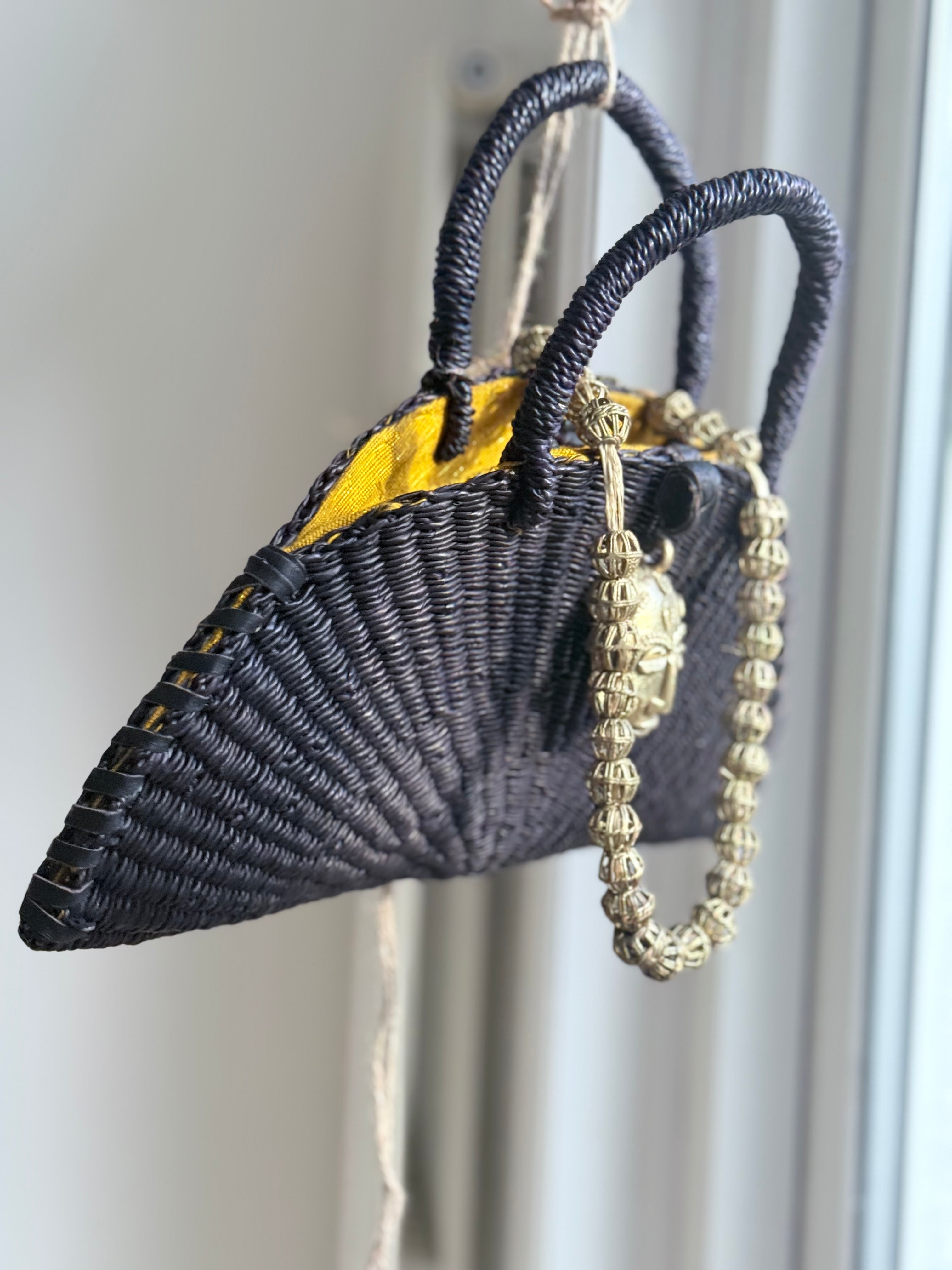 Handwoven Black Half-Moon Raffia Bag with Brass Mask – Artisan Made in Ghana