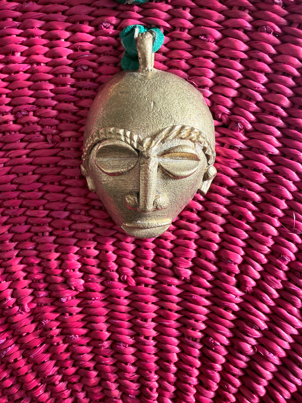 Kongo Handwoven Red Handbag with Brass Mask.